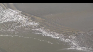 tidal-bore-mount-st-michel-bay